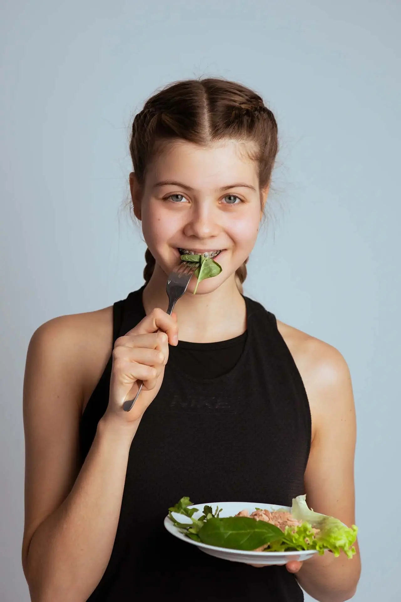 A person eating a healthy vegetable
